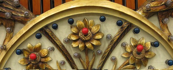 Decorative carved flowers on old fairground ride