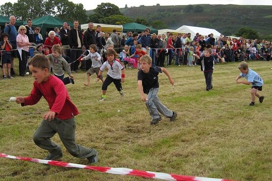 Cildren nearing finishing line in egg and spoon race