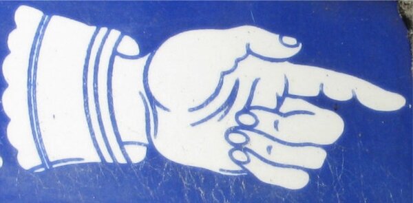 Blue ceramic hand in glove pointing right